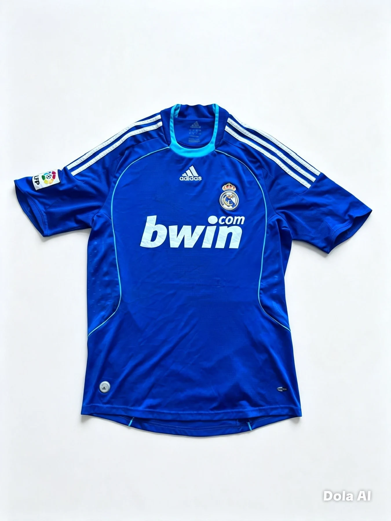 Front view of an authentic 2008-09 Real Madrid away football shirt in royal blue by Adidas.